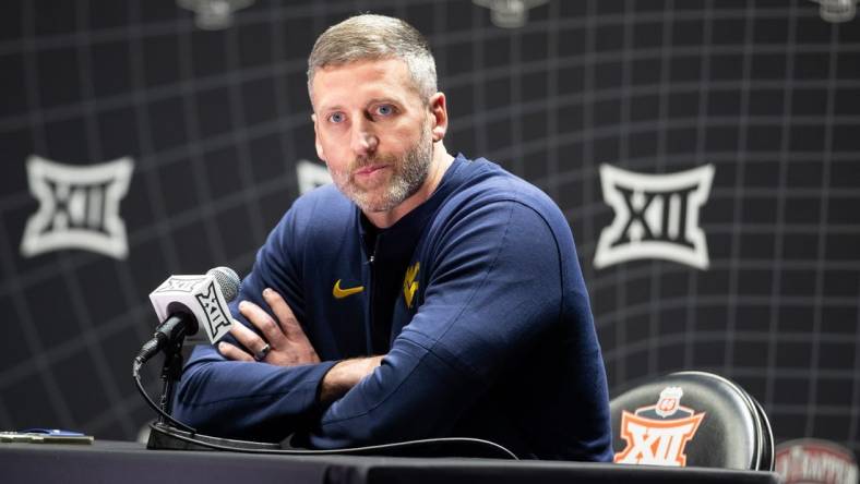 Oct 18, Kansas City, MO, USA; West Virginia interim head coach Josh Eilert answers questions at Big 12 Men s Basketball Tipoff at T-Mobile Center. Mandatory Credit: Kylie Graham-USA TODAY Sports