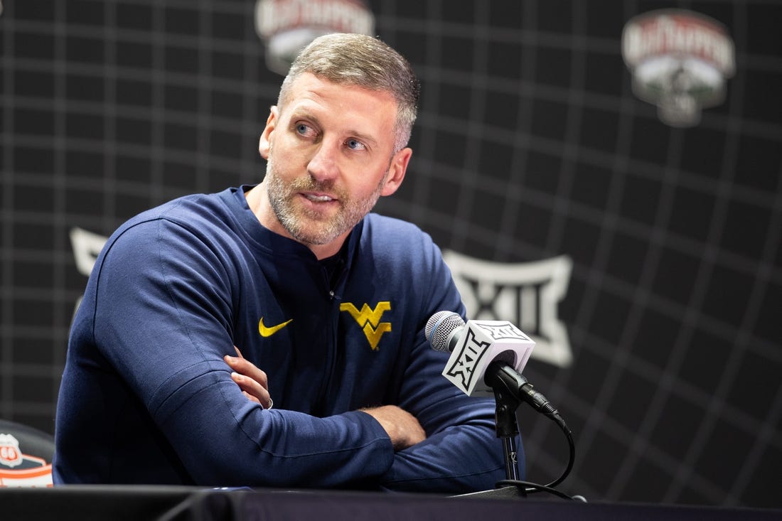 Oct 18, Kansas City, MO, USA; West Virginia interim head coach Josh Eilert answers questions at Big 12 Men s Basketball Tipoff at T-Mobile Center. Mandatory Credit: Kylie Graham-USA TODAY Sports