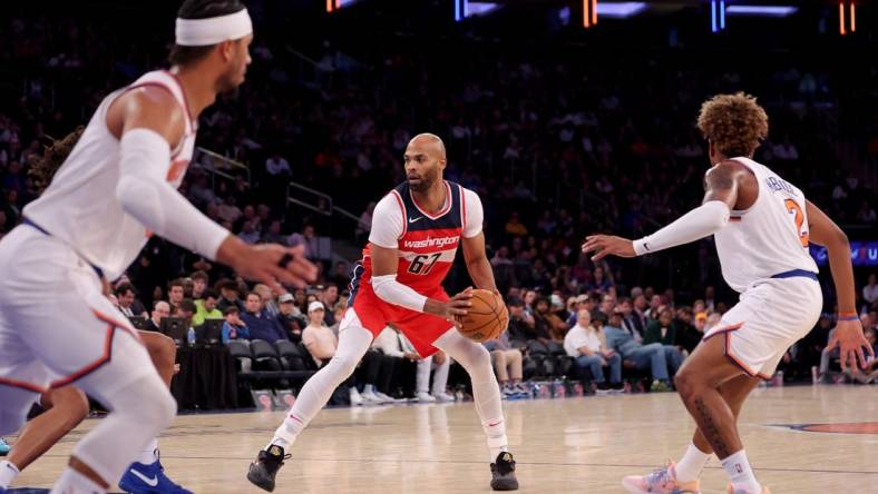 Oct 18, 2023; New York, New York, USA; Washington Wizards forward Taj Gibson (67) controls the ball against the New York Knicks during the fourth quarter at Madison Square Garden. Mandatory Credit: Brad Penner-USA TODAY Sports