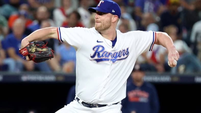 Oct 18, 2023; Arlington, Texas, USA; Texas Rangers pitcher Will Smith (51) throws during the seventh inning of game three of the ALCS against the Houston Astros in the 2023 MLB playoffs at Globe Life Field. Mandatory Credit: Kevin Jairaj-USA TODAY Sports