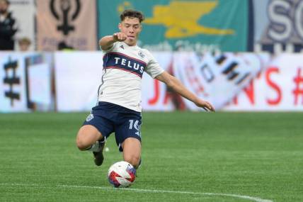 Oct 21, 2023; Vancouver, British Columbia, CAN;  Vancouver Whitecaps FC midfielder Sebastian Berhalter (16) reaches for the ball during the first half against the Los Angeles FC at BC Place. Mandatory Credit: Anne-Marie Sorvin-USA TODAY Sports