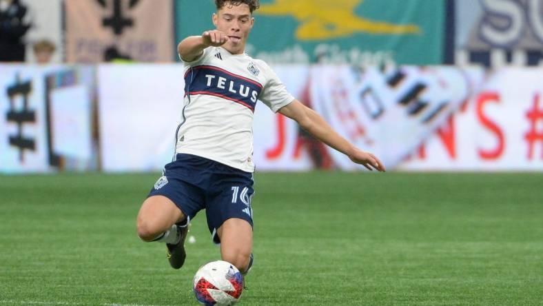 Oct 21, 2023; Vancouver, British Columbia, CAN;  Vancouver Whitecaps FC midfielder Sebastian Berhalter (16) reaches for the ball during the first half against the Los Angeles FC at BC Place. Mandatory Credit: Anne-Marie Sorvin-USA TODAY Sports