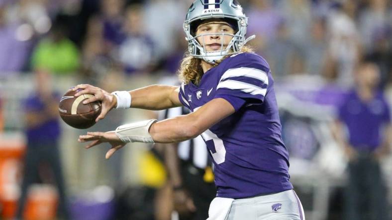 Oct 21, 2023; Manhattan, Kansas, USA; Kansas State Wildcats quarterback Avery Johnson (5) drops back to pass during the first quarter against the TCU Horned Frogs at Bill Snyder Family Football Stadium. Mandatory Credit: Scott Sewell-USA TODAY Sports