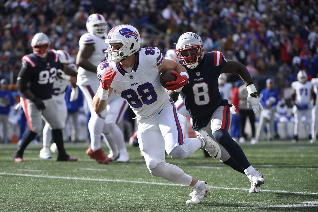 Oct 22, 2023; Foxborough, Massachusetts, USA; Buffalo Bills tight end Dawson Knox (88) runs the ball while New England Patriots linebacker Ja'Whaun Bentley (8) defends during the second half at Gillette Stadium. Mandatory Credit: Bob DeChiara-USA TODAY Sports