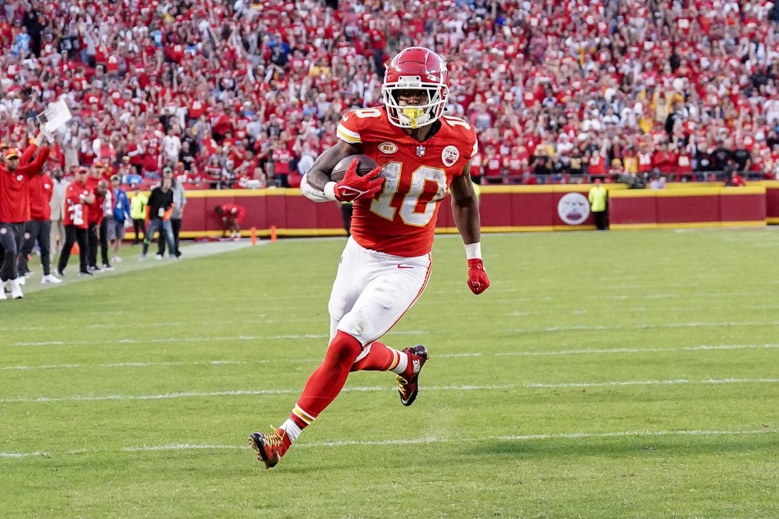 Oct 22, 2023; Kansas City, Missouri, USA; Kansas City Chiefs running back Isiah Pacheco (10) scores a touchdown against the Los Angeles Chargers during the second half at GEHA Field at Arrowhead Stadium. Mandatory Credit: Denny Medley-USA TODAY Sports