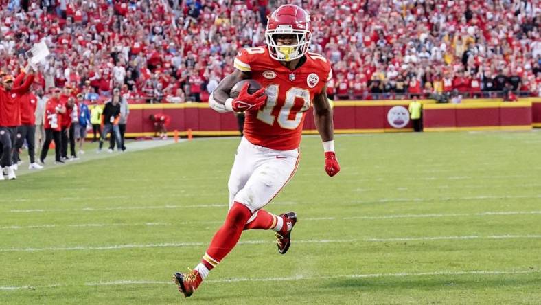 Oct 22, 2023; Kansas City, Missouri, USA; Kansas City Chiefs running back Isiah Pacheco (10) scores a touchdown against the Los Angeles Chargers during the second half at GEHA Field at Arrowhead Stadium. Mandatory Credit: Denny Medley-USA TODAY Sports