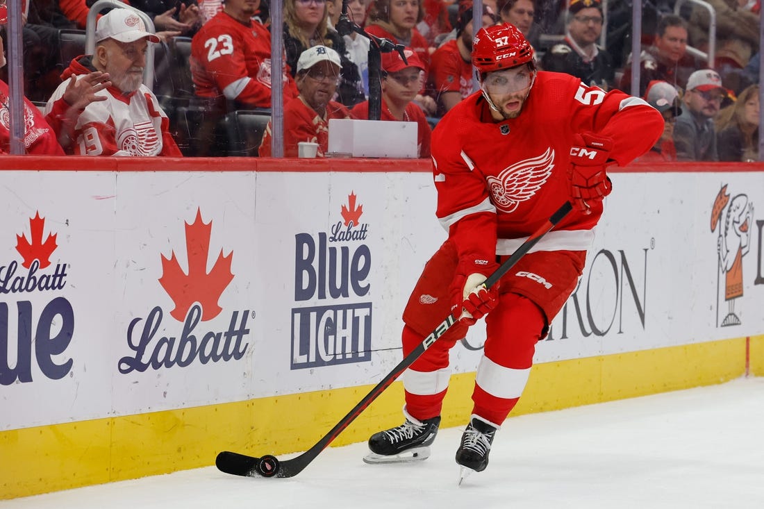 Oct 22, 2023; Detroit, Michigan, USA;  Detroit Red Wings left wing David Perron (57) skates with the puck in the third period against the Calgary Flames at Little Caesars Arena. Mandatory Credit: Rick Osentoski-USA TODAY Sports