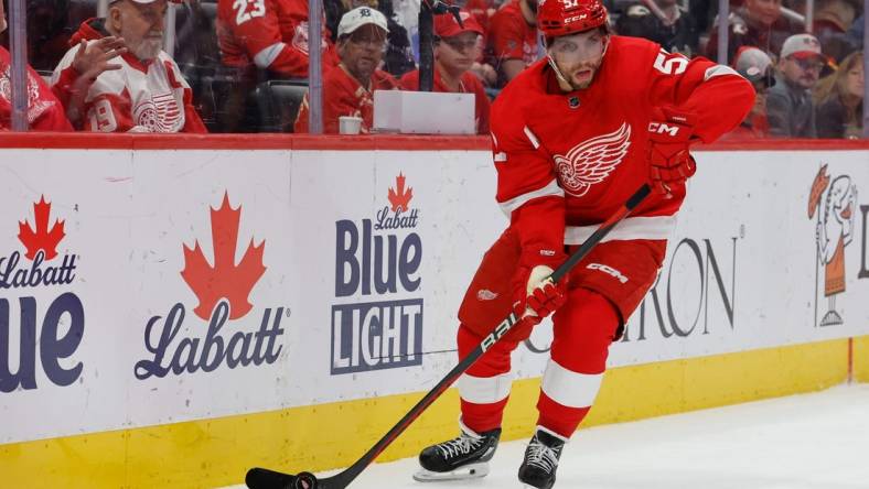 Oct 22, 2023; Detroit, Michigan, USA;  Detroit Red Wings left wing David Perron (57) skates with the puck in the third period against the Calgary Flames at Little Caesars Arena. Mandatory Credit: Rick Osentoski-USA TODAY Sports