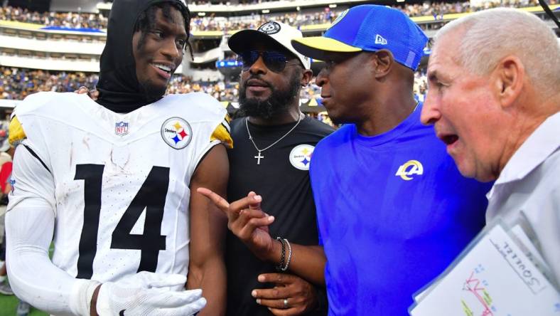 Oct 22, 2023; Inglewood, California, USA; Pittsburgh Steelers wide receiver George Pickens (14) and head coach Mike Tomlin meet with Los Angeles Rams defensive coordinator Raheem Morris following the game at SoFi Stadium. Mandatory Credit: Gary A. Vasquez-USA TODAY Sports