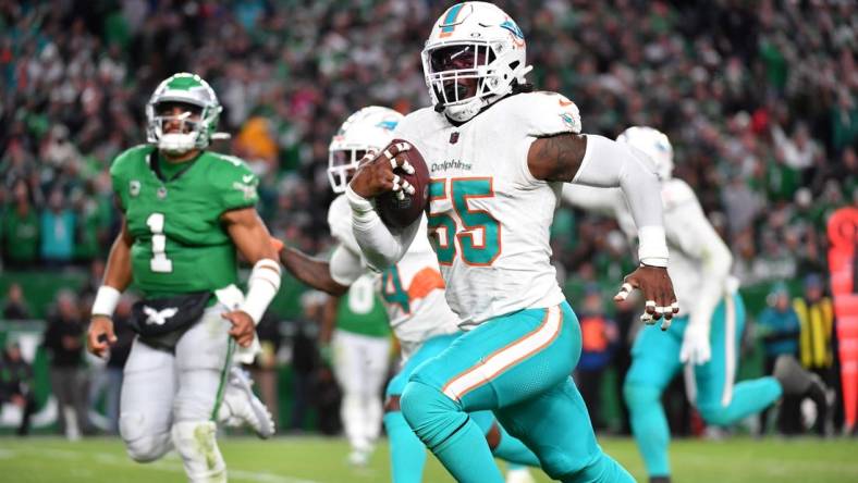 Oct 22, 2023; Philadelphia, Pennsylvania, USA; Miami Dolphins linebacker Jerome Baker (55) returns an interception for a touchdown  during the third quarter against the Philadelphia Eagles at Lincoln Financial Field. Mandatory Credit: Eric Hartline-USA TODAY Sports