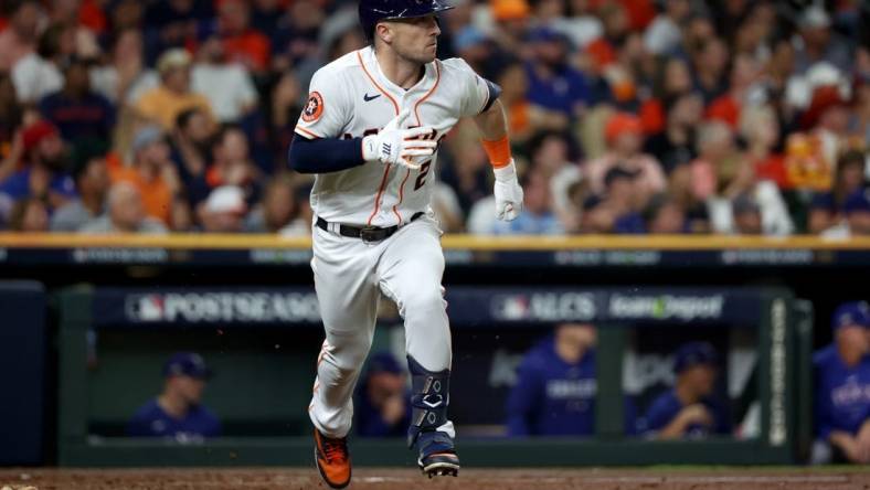 Oct 23, 2023; Houston, Texas, USA; Houston Astros third baseman Alex Bregman (2) doubles during the seventh inning of game seven in the ALCS against the Texas Rangers for the 2023 MLB playoffs at Minute Maid Park. Mandatory Credit: Thomas Shea-USA TODAY Sports