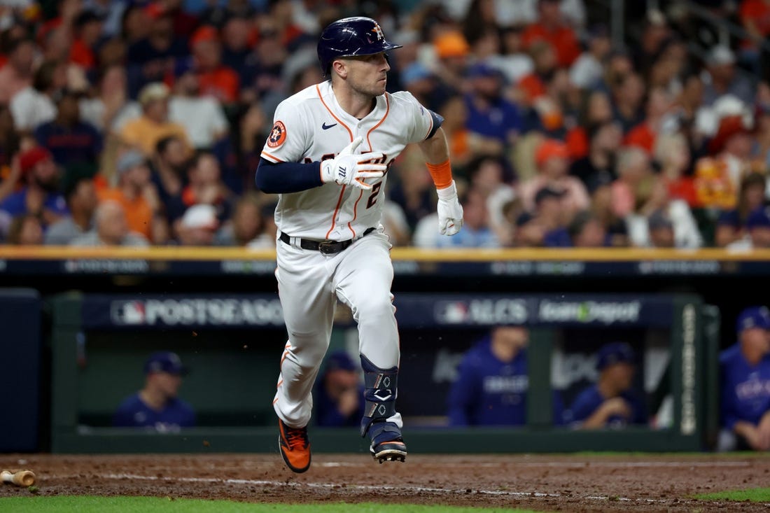 Oct 23, 2023; Houston, Texas, USA; Houston Astros third baseman Alex Bregman (2) doubles during the seventh inning of game seven in the ALCS against the Texas Rangers for the 2023 MLB playoffs at Minute Maid Park. Mandatory Credit: Thomas Shea-USA TODAY Sports