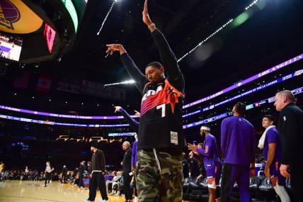 Oct 26, 2023; Los Angeles, California, USA; Phoenix Suns guard Bradley Beal (3) reacts after forward Kevin Durant (35) scores a three point basket against the Los Angeles Lakers during the second half at Crypto.com Arena. Mandatory Credit: Gary A. Vasquez-USA TODAY Sports
