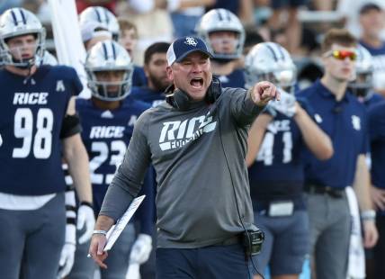 Oct 28, 2023; Houston, Texas, USA; Rice Owls head coach Mike Bloomgren argues about the time clock in the second half against the Tulane Green Wave at Rice Stadium. Mandatory Credit: Thomas Shea-USA TODAY Sports