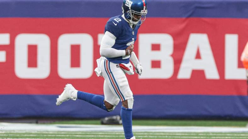 Oct 29, 2023; East Rutherford, New Jersey, USA; New York Giants quarterback Tyrod Taylor (2) runs off the field after an injury during the first half against the New York Jets at MetLife Stadium. Mandatory Credit: Vincent Carchietta-USA TODAY Sports