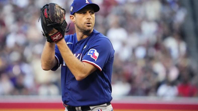 Texas Rangers starting pitcher Max Scherzer (31) prepares to throw a pitch against the Arizona Diamondbacks during the first inning in game three of the 2023 World Series at Chase Field on Oct. 30, 2023, in Phoenix, Arizona.