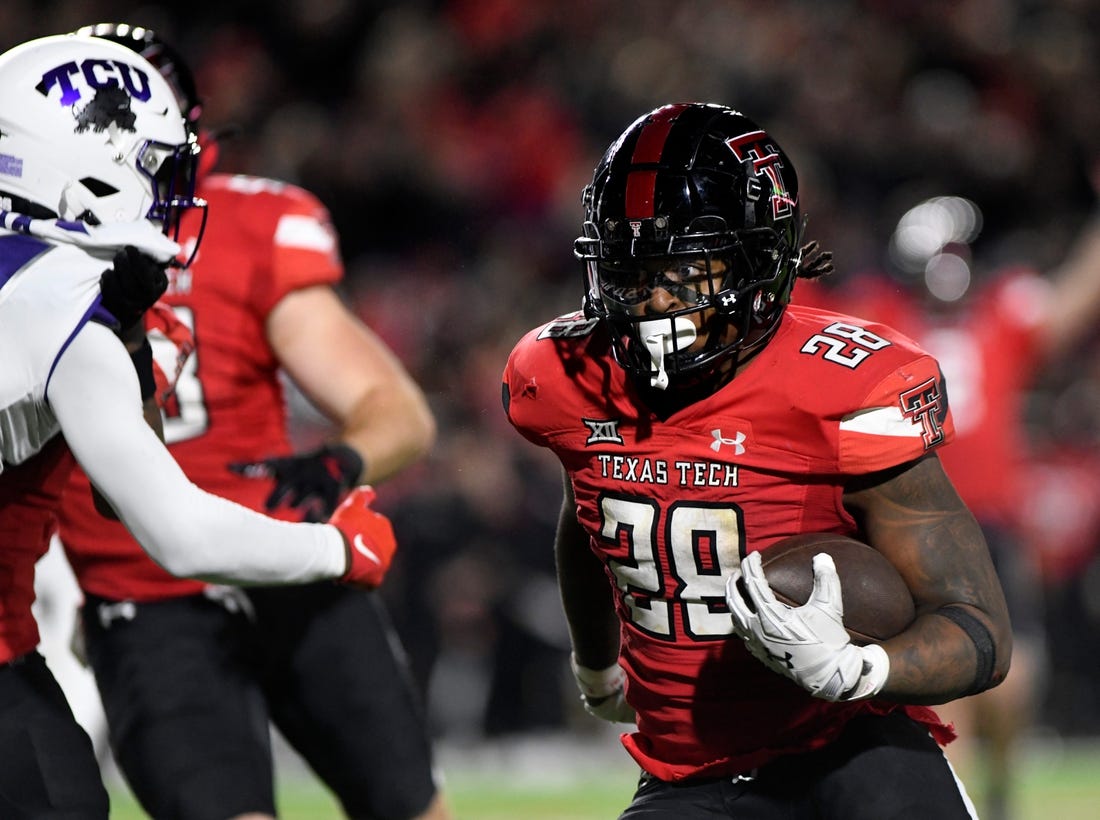 Texas Tech's running back Tahj Brooks (28) runs for a touchdown against TCU in a Big 12 football game, Thursday, Nov. 2, 2023, at Jones AT&T Stadium.