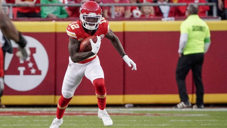 Oct 12, 2023; Kansas City, Missouri, USA; Kansas City Chiefs wide receiver Mecole Hardman Jr. (12) returns a kick against the Los Angeles Chargers during the game at GEHA Field at Arrowhead Stadium. Mandatory Credit: Denny Medley-USA TODAY Sports