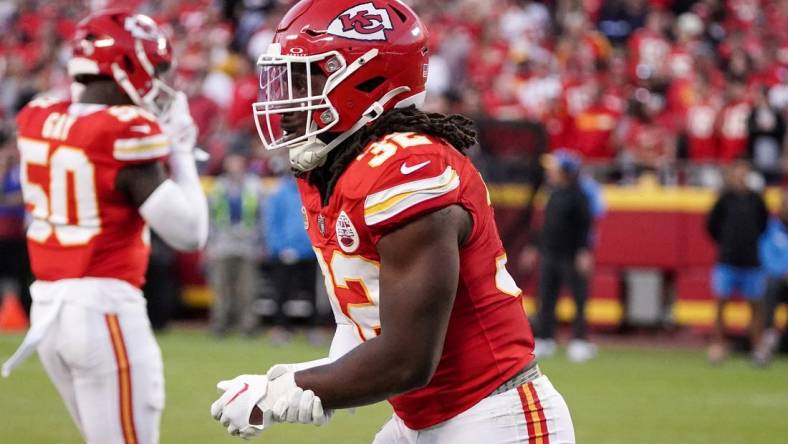 Oct 12, 2023; Kansas City, Missouri, USA; Kansas City Chiefs linebacker Nick Bolton (32) holds his wrist as he leaves the field against the Los Angeles Chargers during the game at GEHA Field at Arrowhead Stadium. Mandatory Credit: Denny Medley-USA TODAY Sports