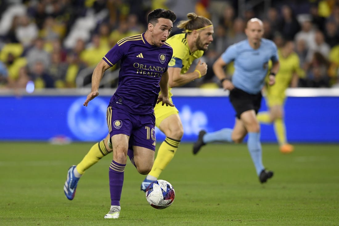 Nov 7, 2023; Nashville, Tennessee, USA; Orlando City midfielder Mauricio Pereyra (10) controls the ball against the Nashville SC in the first half at Geodis Park. Mandatory Credit: Steve Roberts-USA TODAY Sports