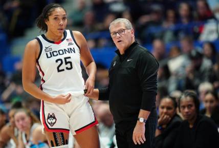 Nov 8, 2023; Hartford, Connecticut, USA; UConn Huskies head coach Geno Auriemma talks with forward Ice Brady (25) from the sideline as they take on the Dayton Flyers at XL Center. Mandatory Credit: David Butler II-USA TODAY Sports