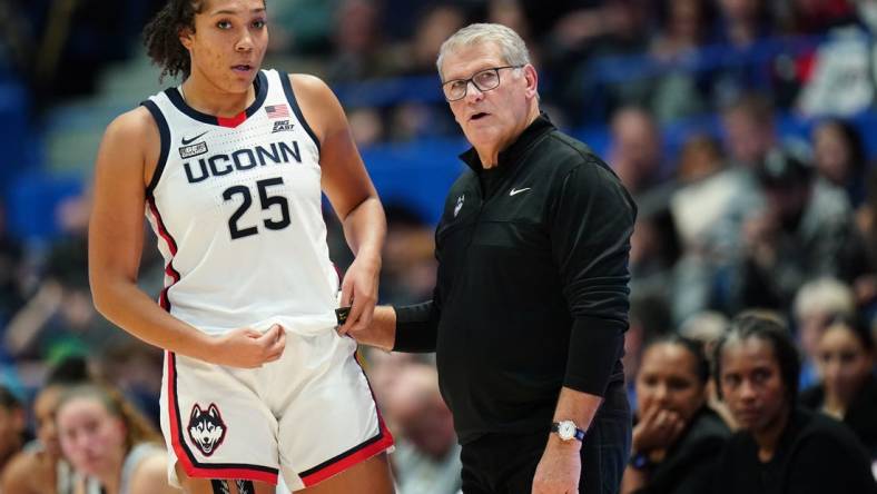 Nov 8, 2023; Hartford, Connecticut, USA; UConn Huskies head coach Geno Auriemma talks with forward Ice Brady (25) from the sideline as they take on the Dayton Flyers at XL Center. Mandatory Credit: David Butler II-USA TODAY Sports