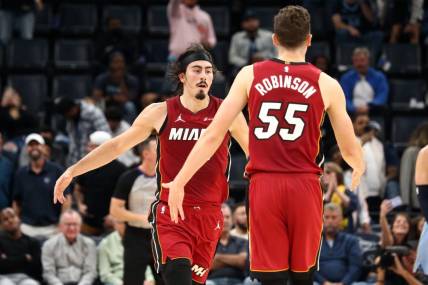 Nov 8, 2023; Memphis, Tennessee, USA; Miami Heat guard Jaime Jaquez Jr. (11) reacts with forward Duncan Robinson (55) after a three point basket during the second half against the Memphis Grizzlies at FedExForum. Mandatory Credit: Petre Thomas-USA TODAY Sports