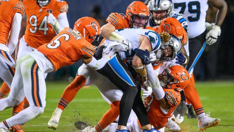 Nov 9, 2023; Chicago, Illinois, USA; Carolina Panthers tight end Hayden Hurst (81) is tackled after a reception against the Chicago Bears during the fourth quarter at Soldier Field. Mandatory Credit: Daniel Bartel-USA TODAY Sports