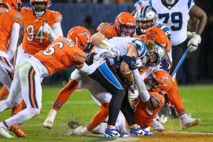 Nov 9, 2023; Chicago, Illinois, USA; Carolina Panthers tight end Hayden Hurst (81) is tackled after a reception against the Chicago Bears during the fourth quarter at Soldier Field. Mandatory Credit: Daniel Bartel-USA TODAY Sports