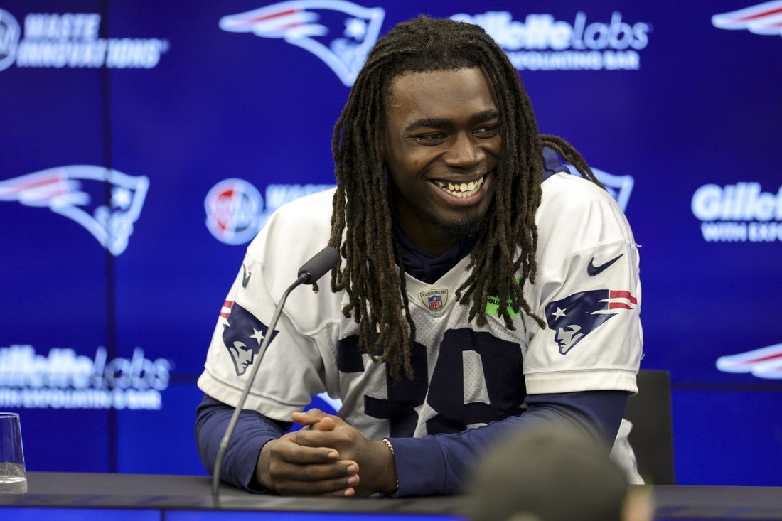 Nov 10, 2023; Frankfurt, Germany;  New England Patriots running back Rhamondre Stevenson (38) speaks to the media before an NFL International Series practice at the Deutcher Fussball-Bund facility. Mandatory Credit: Nathan Ray Seebeck-USA TODAY Sports