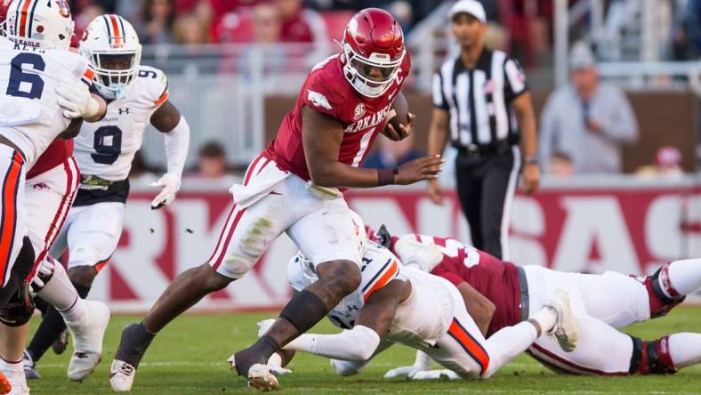 Nov 11, 2023; Fayetteville, Arkansas, USA;  Arkansas Razorbacks quarterback KJ Jefferson (1) gets past Auburn Tigers linebacker Elijah McAllister (11) during the second quarter at Donald W. Reynolds Razorback Stadium. Mandatory Credit: Brett Rojo-USA TODAY Sports