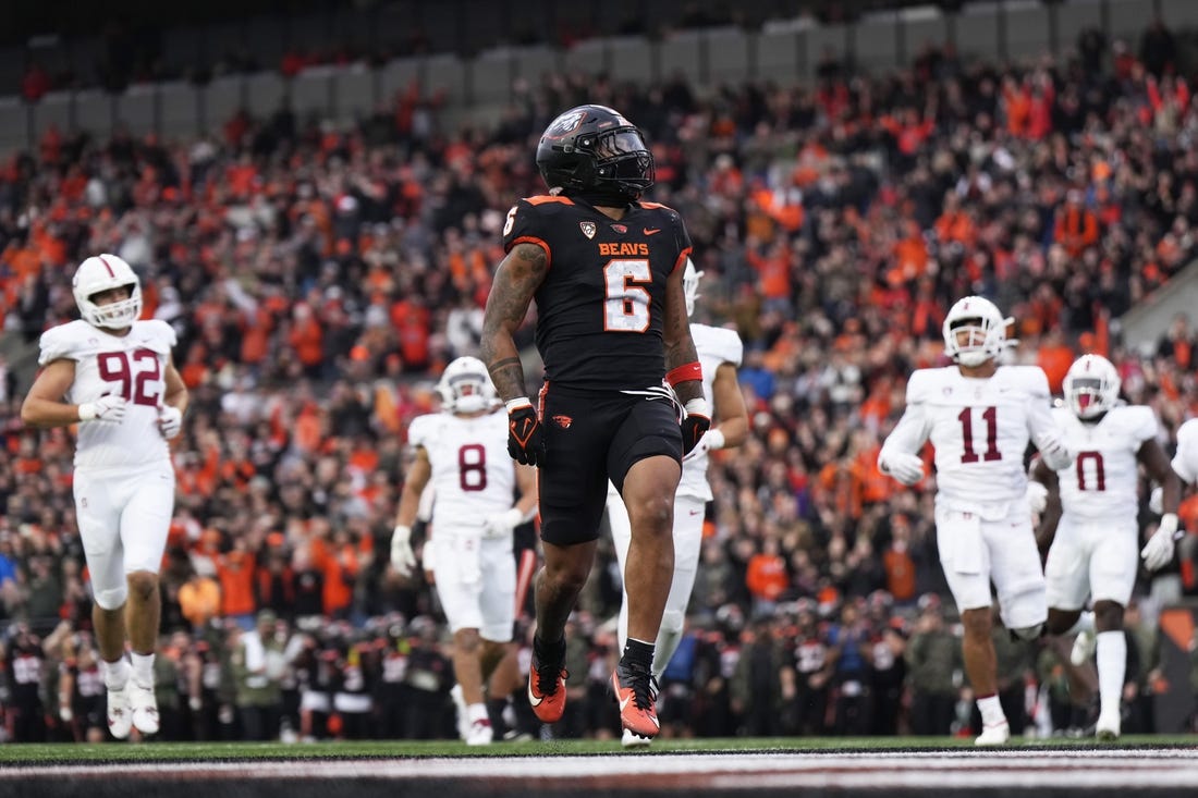 Nov 11, 2023; Corvallis, Oregon, USA; Oregon State Beavers running back Damien Martinez (6) runs with the ball for a touchdown during the first half against the Stanford Cardinal at Reser Stadium. Mandatory Credit: Soobum Im-USA TODAY Sports