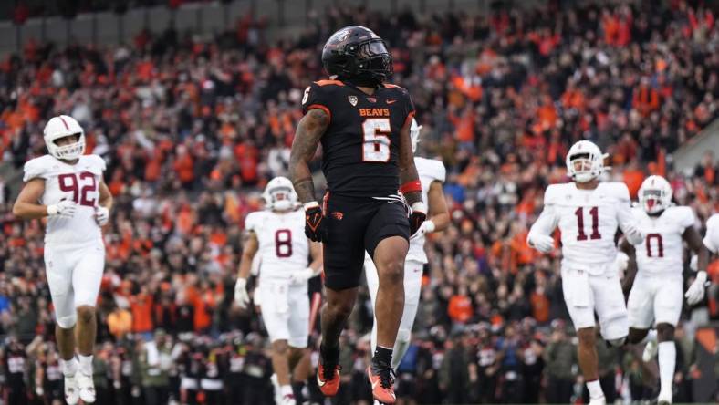 Nov 11, 2023; Corvallis, Oregon, USA; Oregon State Beavers running back Damien Martinez (6) runs with the ball for a touchdown during the first half against the Stanford Cardinal at Reser Stadium. Mandatory Credit: Soobum Im-USA TODAY Sports