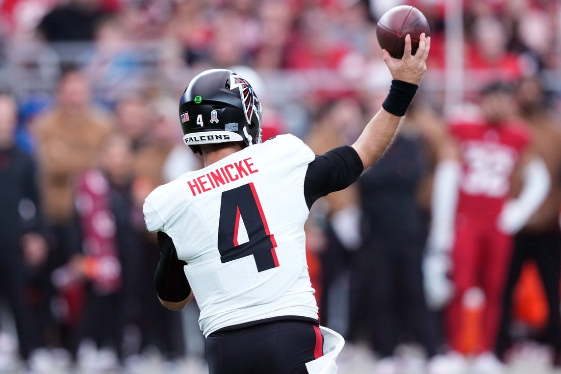 Nov 12, 2023; Glendale, Arizona, USA; Atlanta Falcons quarterback Taylor Heinicke (4) throws against the Arizona Cardinals during the first half at State Farm Stadium. Mandatory Credit: Joe Camporeale-USA TODAY Sports