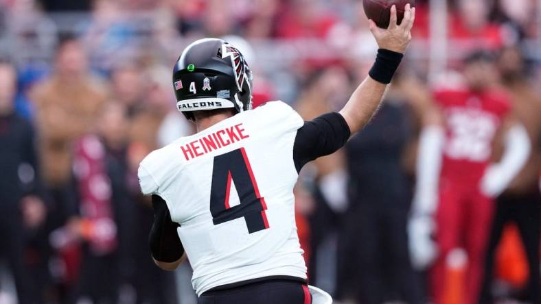 Nov 12, 2023; Glendale, Arizona, USA; Atlanta Falcons quarterback Taylor Heinicke (4) throws against the Arizona Cardinals during the first half at State Farm Stadium. Mandatory Credit: Joe Camporeale-USA TODAY Sports