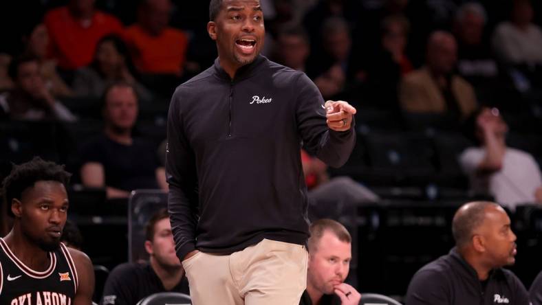 Nov 16, 2023; Brooklyn, New York, USA; Oklahoma State Cowboys head coach Mike Boynton coaches against the St. Bonaventure Bonnies during the first half at Barclays Center. Mandatory Credit: Brad Penner-USA TODAY Sports