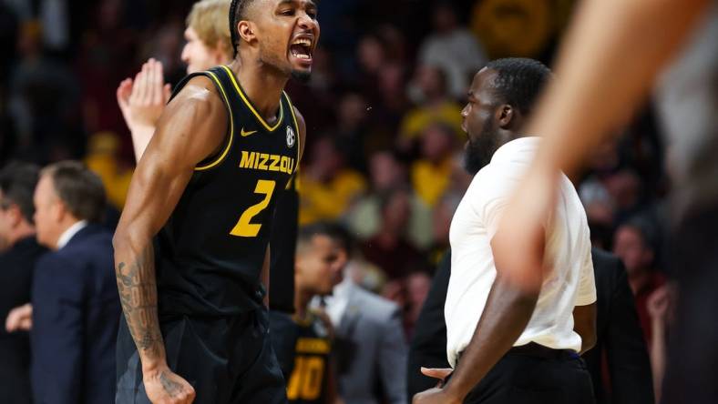 Nov 16, 2023; Minneapolis, Minnesota, USA; Missouri Tigers guard Tamar Bates (2) celebrates the win against the Minnesota Golden Gophers at Williams Arena. Mandatory Credit: Matt Krohn-USA TODAY Sports