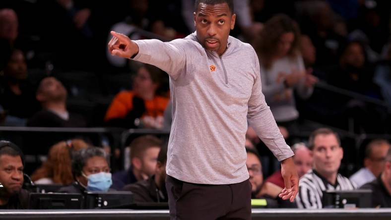 Nov 17, 2023; Brookyln, NY, USA; Oklahoma State Cowboys head coach Mike Boynton coaches against the Notre Dame Fighting Irish during overtime at Barclays Center. Mandatory Credit: Brad Penner-USA TODAY Sports