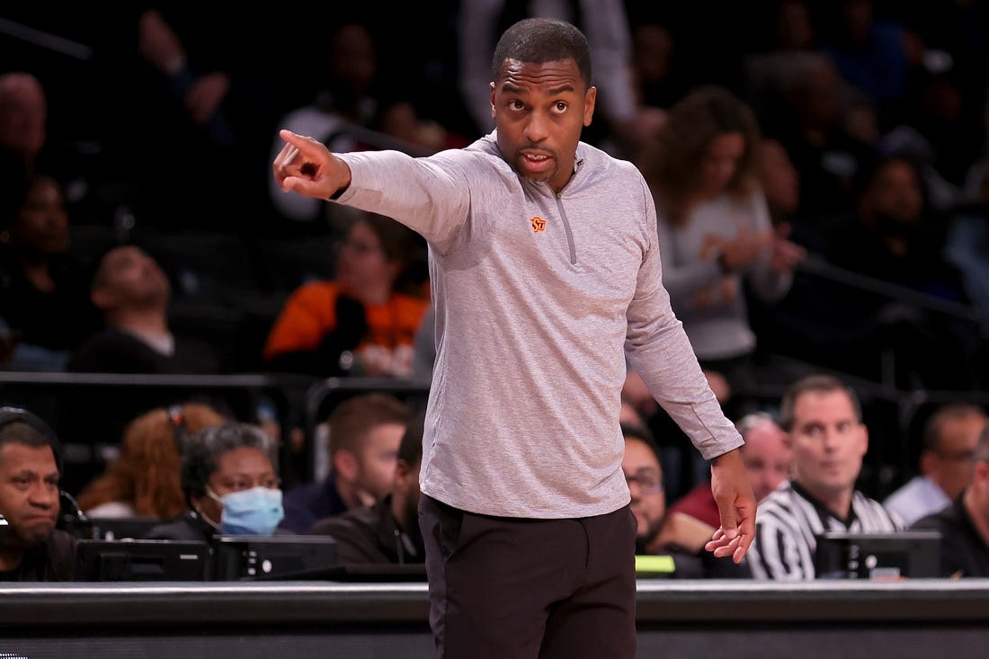 Nov 17, 2023; Brookyln, NY, USA; Oklahoma State Cowboys head coach Mike Boynton coaches against the Notre Dame Fighting Irish during overtime at Barclays Center. Mandatory Credit: Brad Penner-USA TODAY Sports