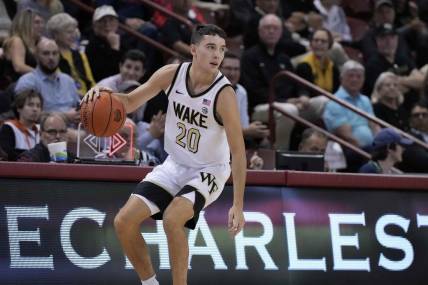 Nov 17, 2023; Charleston, SC, USA; Wake Forest Demon Deacons guard Parker Friedrichsen (20) brings the ball up court in the first half against the Towson Tigers at TD Arena. Mandatory Credit: David Yeazell-USA TODAY Sports