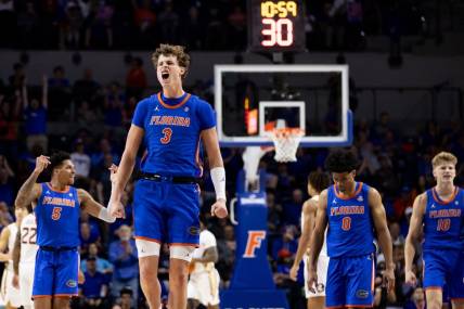 Nov 17, 2023; Gainesville, Florida, USA; Florida Gators center Micah Handlogten (3) celebrates during a timeout during the first half against the Florida State Seminoles at Exactech Arena at the Stephen C. O'Connell Center. Mandatory Credit: Matt Pendleton-USA TODAY Sports