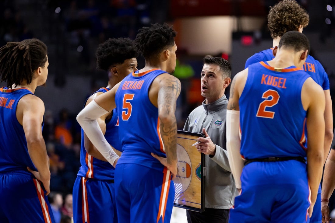 Nov 17, 2023; Gainesville, Florida, USA; Florida Gators head coach Todd Golden talks with Florida Gators guard Zyon Pullin (0), Florida Gators guard Walter Clayton Jr. (1), Florida Gators guard Will Richard (5), and Florida Gators guard Riley Kugel (2) during the second half against the Florida State Seminoles at Exactech Arena at the Stephen C. O'Connell Center. Mandatory Credit: Matt Pendleton-USA TODAY Sports