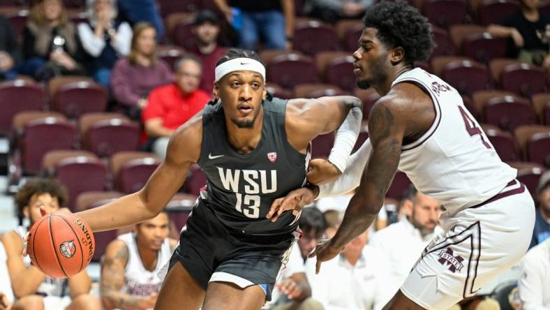 Nov 18, 2023; Uncasville, CT, USA; Washington State Cougars forward Isaac Jones (13) dribbles the ball defended by Washington State Cougars guard Shae Korpela (4) during the first half at Mohegan Sun Arena. Mandatory Credit: Mark Smith-USA TODAY Sports