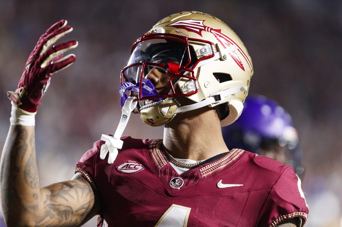 Nov 18, 2023; Tallahassee, Florida, USA; Florida State Seminoles wide receiver Keon Coleman (4) celebrates a touchdown against the North Alabama Lions during the third quarter at Doak S. Campbell Stadium. Mandatory Credit: Morgan Tencza-USA TODAY Sports