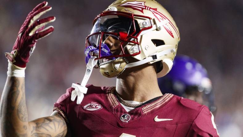 Nov 18, 2023; Tallahassee, Florida, USA; Florida State Seminoles wide receiver Keon Coleman (4) celebrates a touchdown against the North Alabama Lions during the third quarter at Doak S. Campbell Stadium. Mandatory Credit: Morgan Tencza-USA TODAY Sports