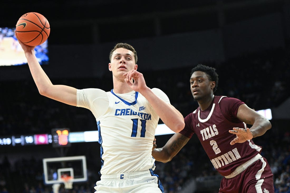 Nov 18, 2023; Omaha, Nebraska, USA;  Creighton Bluejays center Ryan Kalkbrenner (11) looks to drive against Texas Southern Tigers forward Jahmar Young Jr. (2) in the first half at CHI Health Center Omaha. Mandatory Credit: Steven Branscombe-USA TODAY Sports