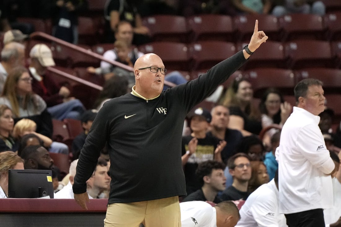 Nov 19, 2023; Charleston, SC, USA; Wake Forest Demon Deacons head coach Steve Forbes sends a play in the first half against the LSU Tigers at TD Arena. Mandatory Credit: David Yeazell-USA TODAY Sports