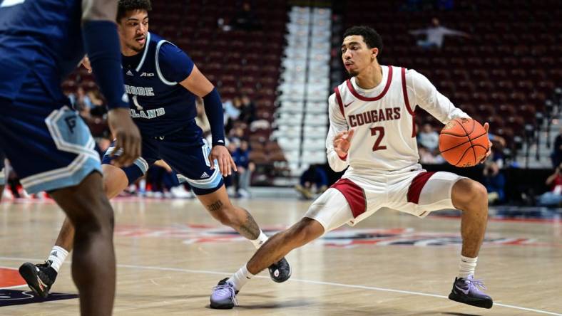 Nov 19, 2023; Uncasville, CT, USA; Washington State Cougars guard Myles Rice (2) dribbles the ball defended by Rhode Island Rams guard Luis Kortright (1) during the second half at Mohegan Sun Arena. Mandatory Credit: Mark Smith-USA TODAY Sports