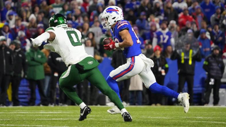 Nov 19, 2023; Orchard Park, New York, USA; Buffalo Bills wide receiver Khalil Shakir (10) runs with the ball after making a catch against New York Jets safety Adrian Amos (0) during the first half at Highmark Stadium. Mandatory Credit: Gregory Fisher-USA TODAY Sports