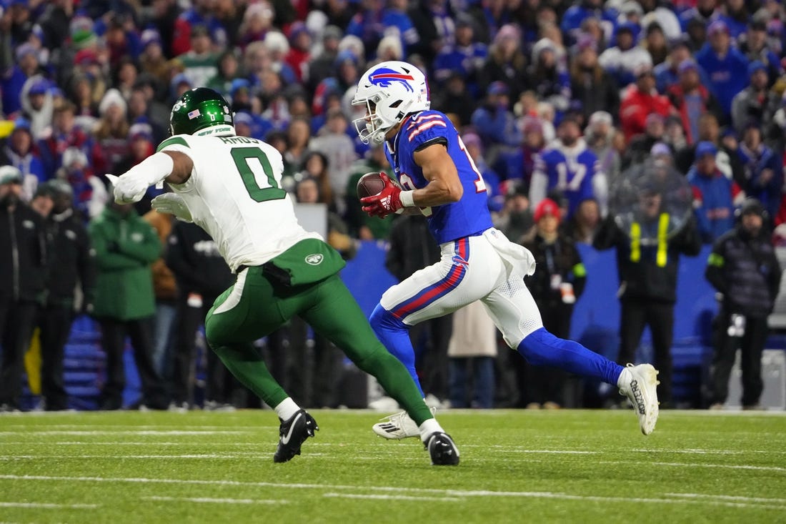Nov 19, 2023; Orchard Park, New York, USA; Buffalo Bills wide receiver Khalil Shakir (10) runs with the ball after making a catch against New York Jets safety Adrian Amos (0) during the first half at Highmark Stadium. Mandatory Credit: Gregory Fisher-USA TODAY Sports